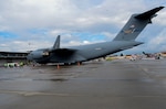 A C-17 Globemaster III aircraft sits on the flight line.