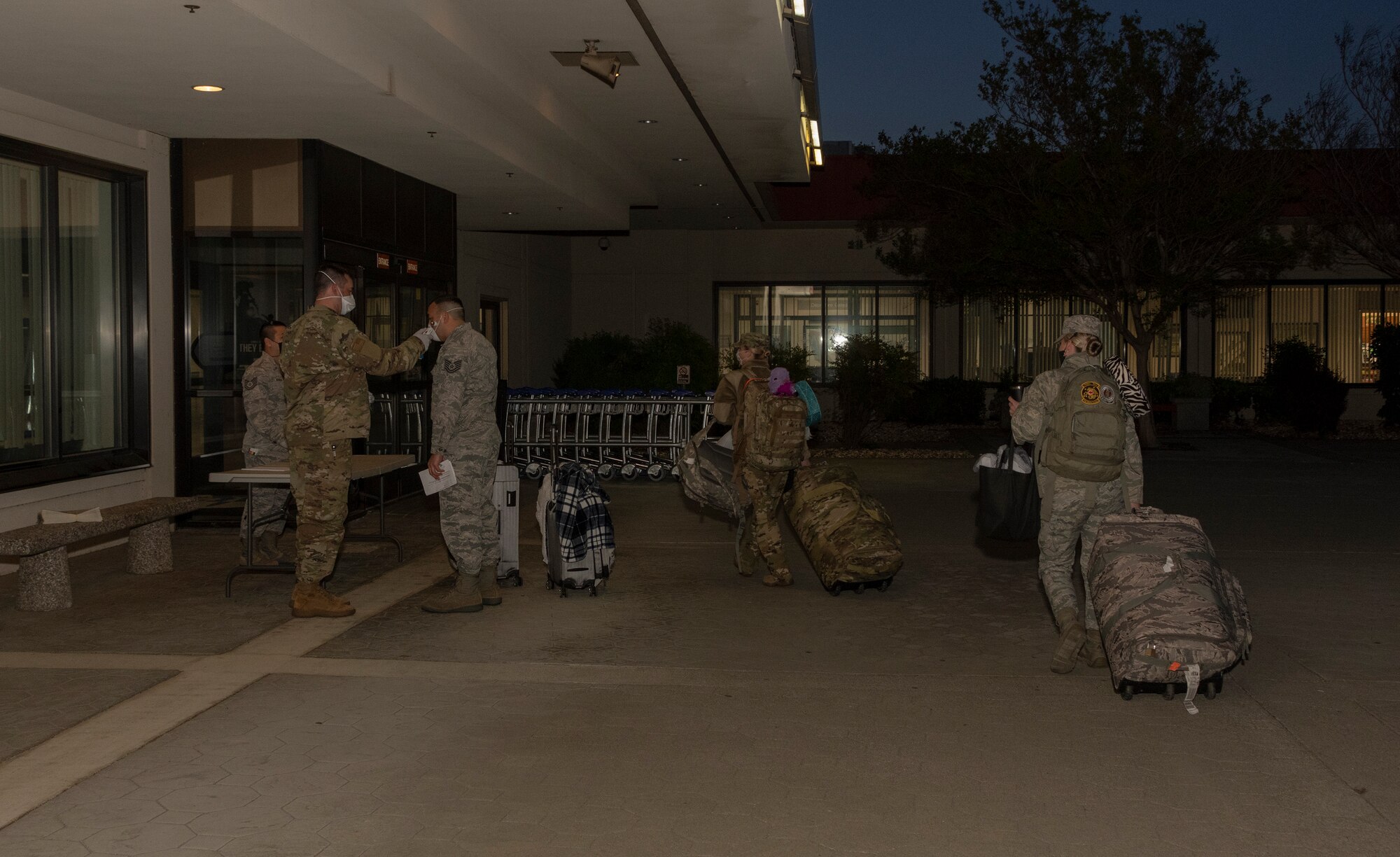U.S. Air Force personnel from the 349th Medical Group receive a medical screening prior to deployment April 22, 2020, at Travis Air Force Base, California. Medical personnel from the 349th MDG deployed to New York in support of a short-notice COVID-19 mission. (U.S. Air Force photo by Heide Couch)