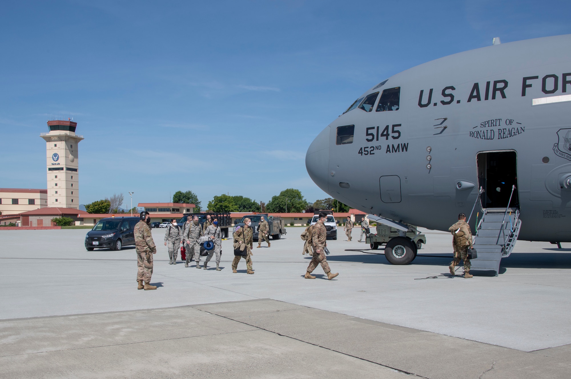 U.S. Air Force personnel from the 349th Medical Group board a U.S. Air Force C-17 Globemaster III from March Air Reserve Base, California, April 22, 2020, at Travis Air Force Base, California. The aircraft provided deployment airlift for 349th MDG personnel from Travis AFB to New York in support of a short-notice COVID-19 mission. (U.S. Air Force photo by Heide Couch)