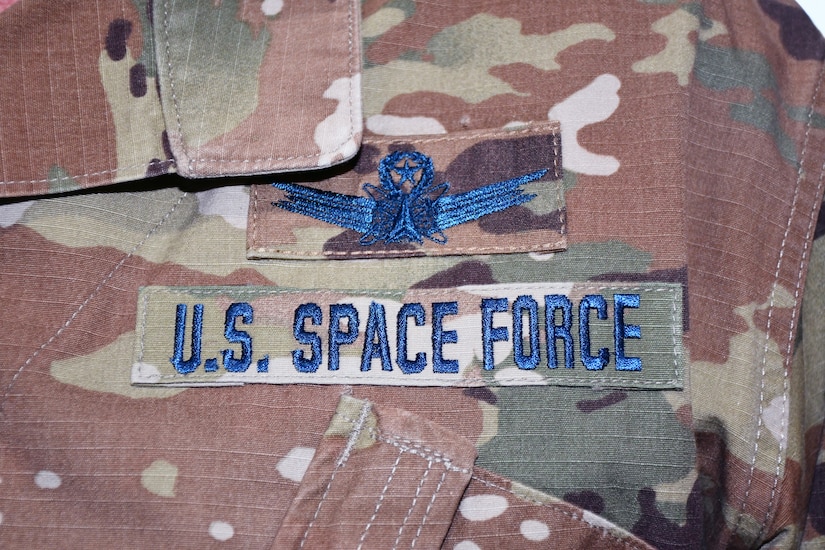 A service uniform features “U.S. Space Force” and the branch’s emblem.