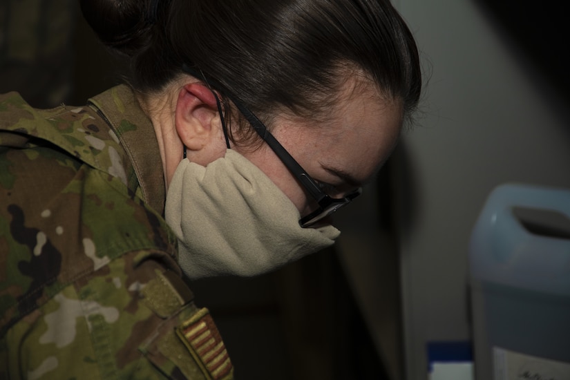 Senior Airman Caitlyn Truax, 11th Security Support Squadron supply technician, looks over hand sanitizer sign out information on Joint Base Andrews, Md., April 20, 2020. When units run out of hand sanitizer, they’re able to sign out a gallon from supply.