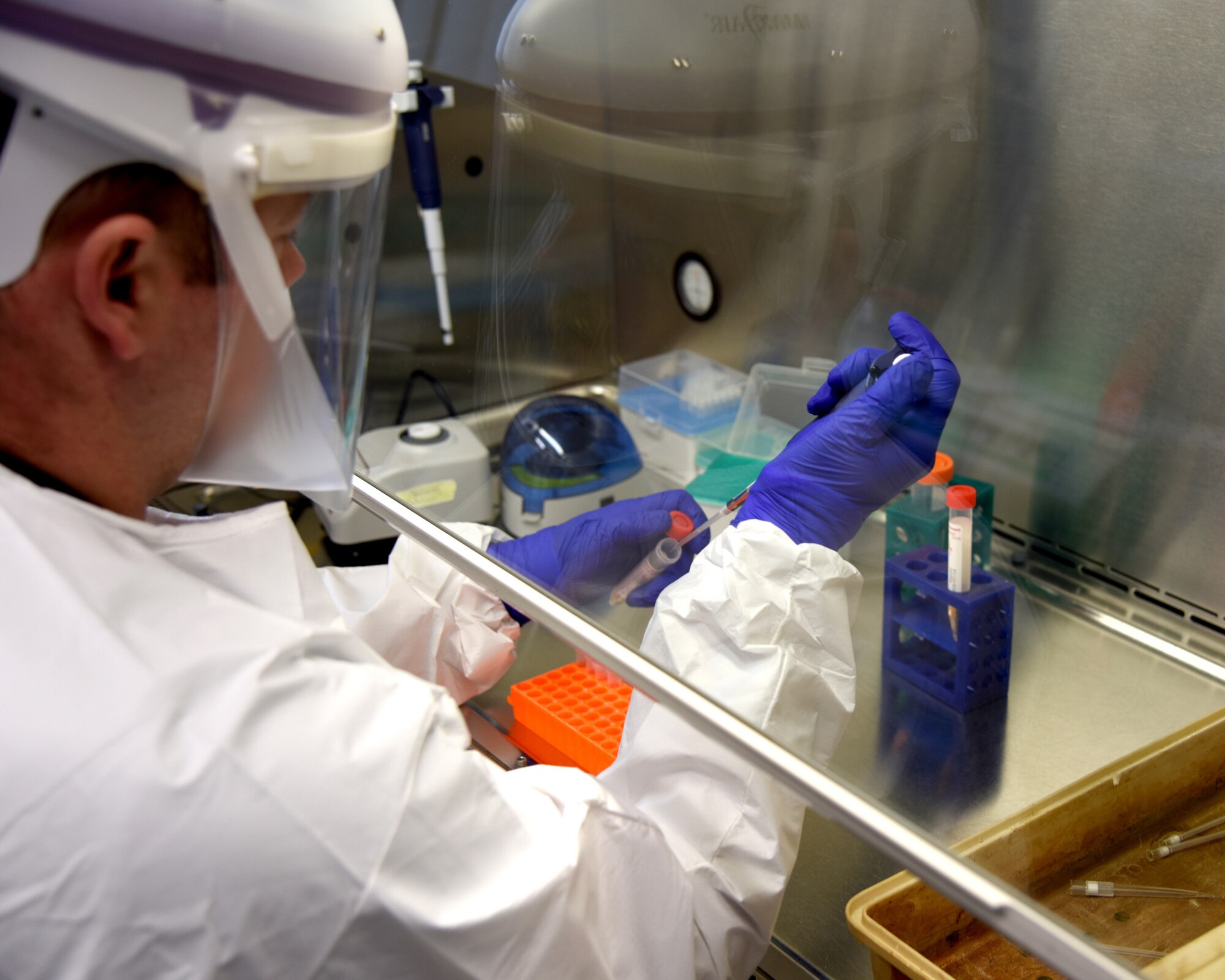 Capt. Nicholas Buck, a medical operations officer and medical section leader with the Michigan Army National Guard's 51st Civil Support Team, tests for COVID-19 at the Michigan Bureau of Laboratories, Michigan Department of Health and Human Services, in Lansing April 17, 2020.