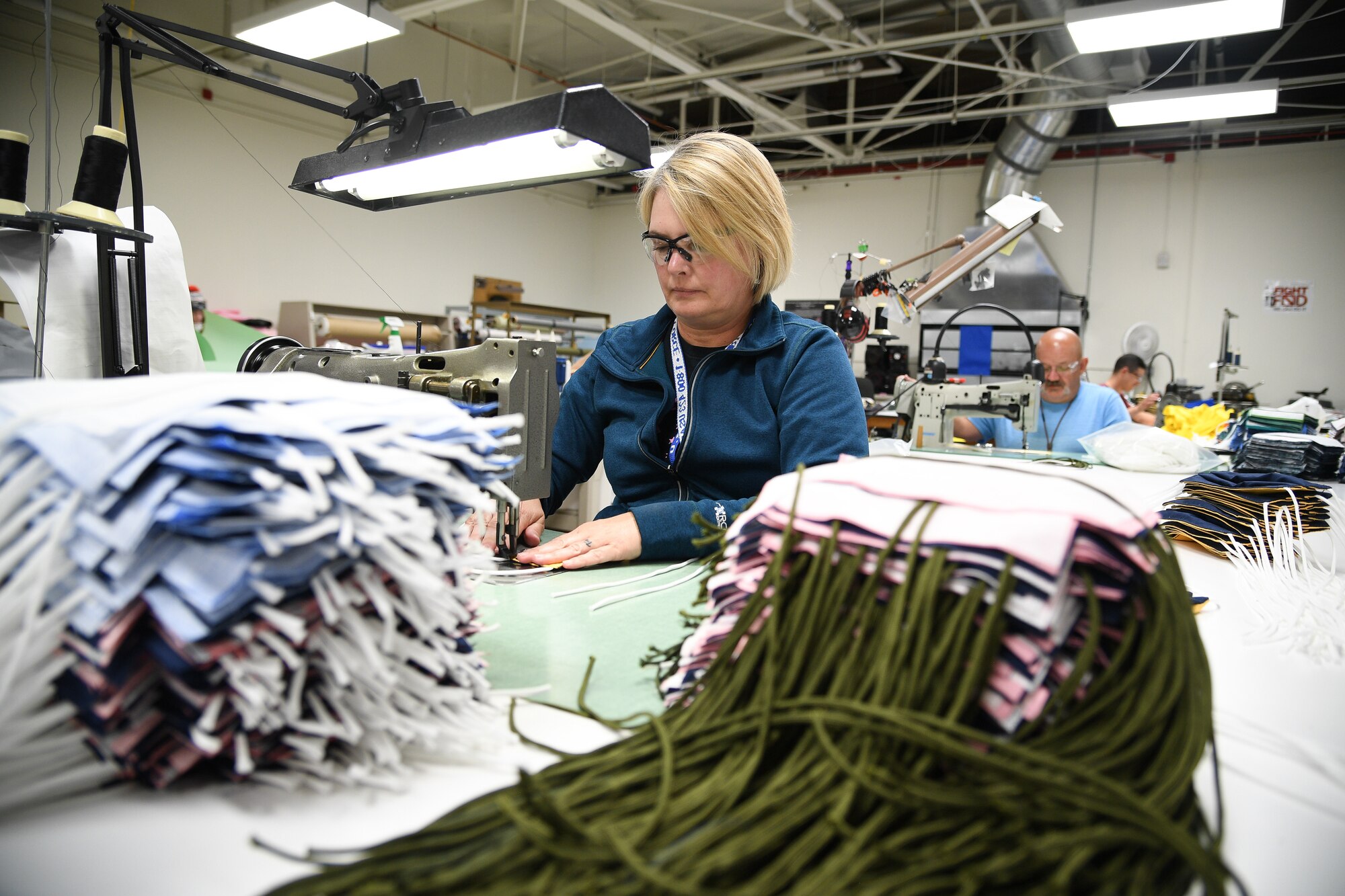 Aircrew Flight Equipment technicians with the 531st Armament Textile Shop make protective cloth masks at Hill Air Force Base, Utah, April 15, 2020. The shop is using their skill set and equipment to produce cloth face coverings for members of Team Hill. (U.S. Air Force photo by R. Nial Bradshaw)