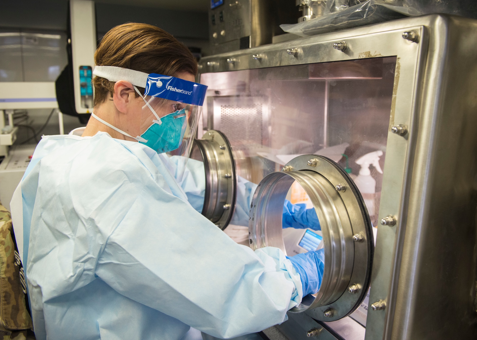 U.S. Army Capt. Joyce Avedisian, 14th Civil Support Team nuclear medical science officer, prepares to test patient samples for COVID-19 in an analytical laboratory system vehicle parked outside Charter Oak Family Health Center in Hartford, Connecticut, April 24, 2020. The Connecticut National Guard’s 14th Civil Support Team is working in partnership with the Connecticut Department of Public Health state lab to test samples from 70 to 80 patients per day in locations throughout the state. (U.S. Air National Guard photo by Staff Sgt. Steven Tucker)