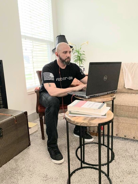An Army Corps employee works from home