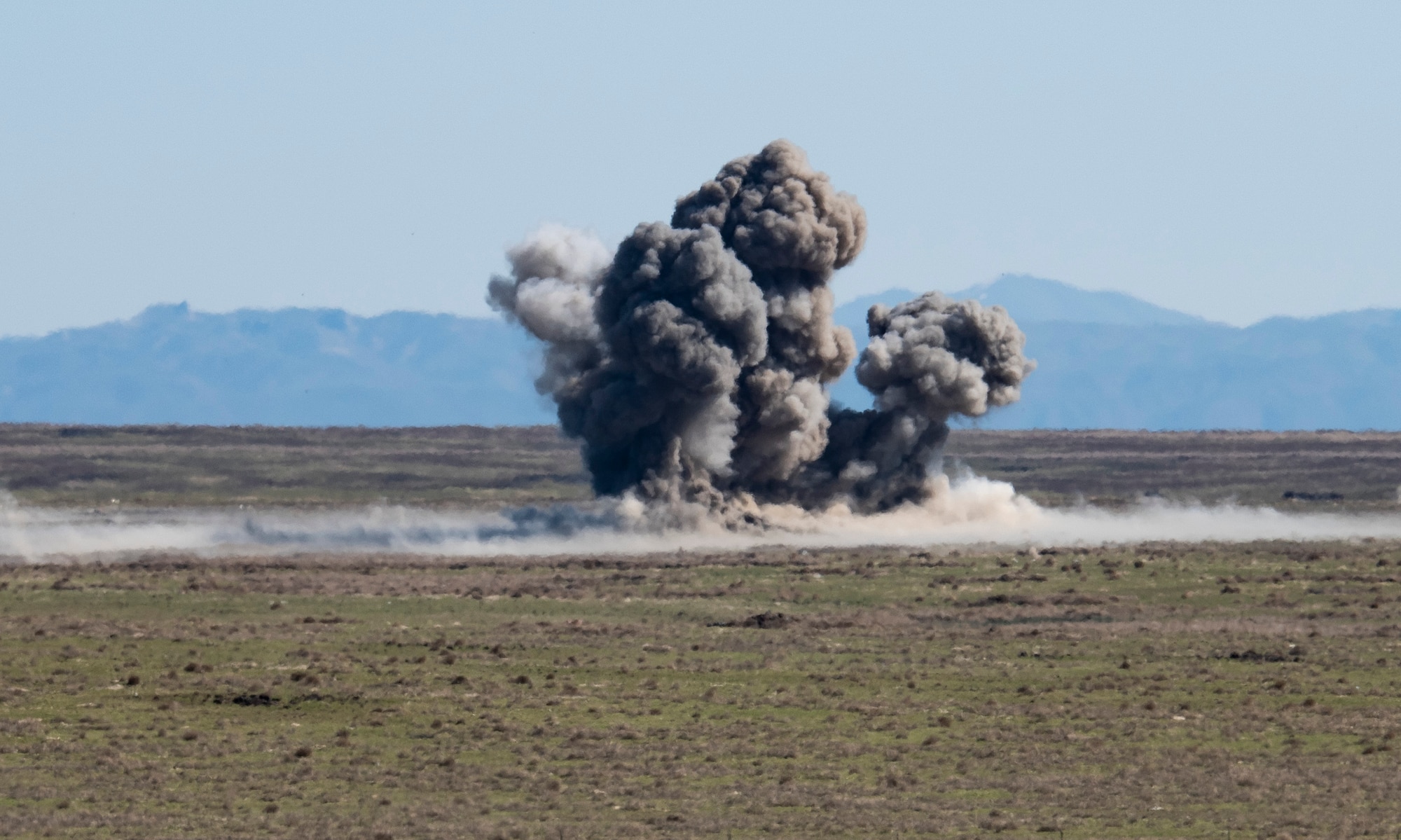 An exposion from a Mark 82 bomb ignites, April 17, 2020, at Orchard Combat Training Center, Idaho. Two F-15E Strike Eagles from the 391st Fighter Squadron dropped six Mark 82 bombs into the dudded impact area to enhance training capabilities with the Army National Guard. (U.S. Air Force photo by Airman Natalie Rubenak).