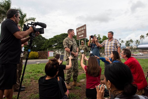 Rear Adm. Robert Chadwick speaks with news media outside Joint Base Pearl Harbor-Hickam