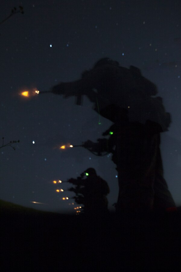 U.S. Marines with Battalion Landing Team, 1st Battalion, 4th Marine Regiment, 15th Marine Expeditionary Unit, fire their service rifles during a Raid Leaders Course combat marksmanship range at Marine Corps Base Camp Pendleton, California, April 22, 2020. Marines focused on raid tactics, techniques and procedures applicable to raid operations in order to enhance their combat readiness while also maintaining COVID-19 mitigation measures. (U.S. Marine Corps photo by Lance Cpl. Brendan Mullin)
