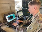 Sgt. Cohen Berania, a team leader for Company C, 146th Expeditionary Signal Battalion, conducts signal proficiency training on a battalion Command Post Node (CPN). A CPN is used to provide classified and unclassified data and phones to users in remote environments.
