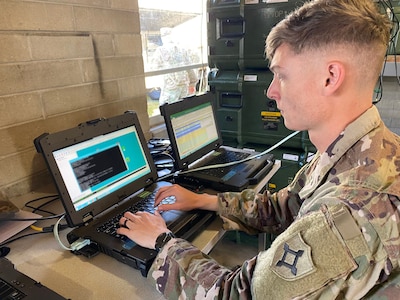 Sgt. Cohen Berania, a team leader for Company C, 146th Expeditionary Signal Battalion, conducts signal proficiency training on a battalion Command Post Node (CPN). A CPN is used to provide classified and unclassified data and phones to users in remote environments.