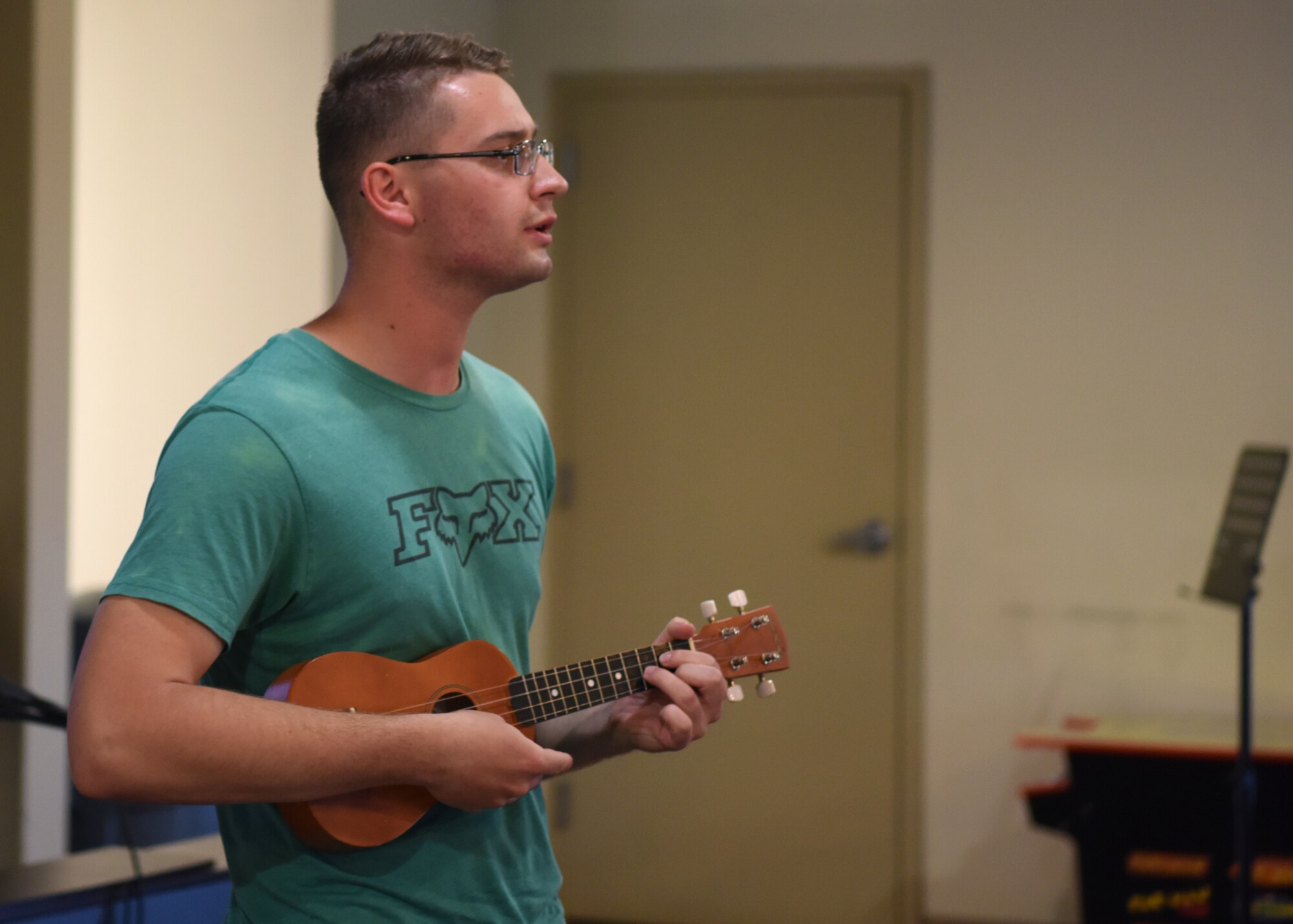 U.S. Air Force Airman 1st Class Michael Bachand, 315th Training Squadron student, performs a cover of Hallelujah by Leonard Cohen at Crossroads on Goodfellow Air Force Base, Texas, April 24. Bachand finished his performance with a falsetto surprising everyone in the audience. (U.S. Air Force photo by Airman 1st Class Ethan Sherwood)