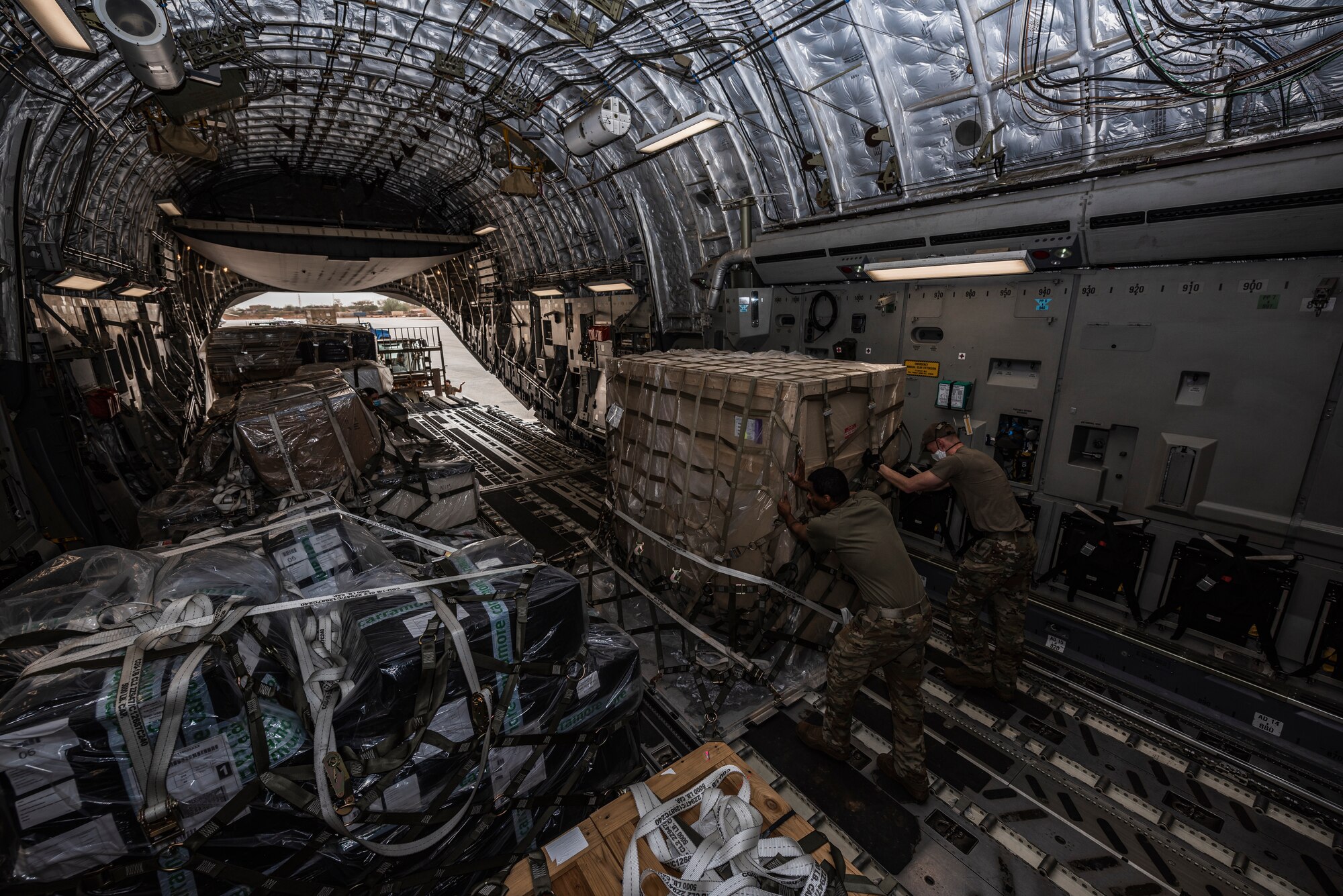 Airmen unloading a C-17 Globemaster III.