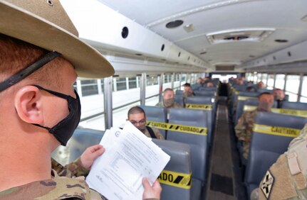 A drill sergeant checks to make sure all Soldiers have boarded the bus that will take them to Joint Base San Antonio-Fort Sam Houston