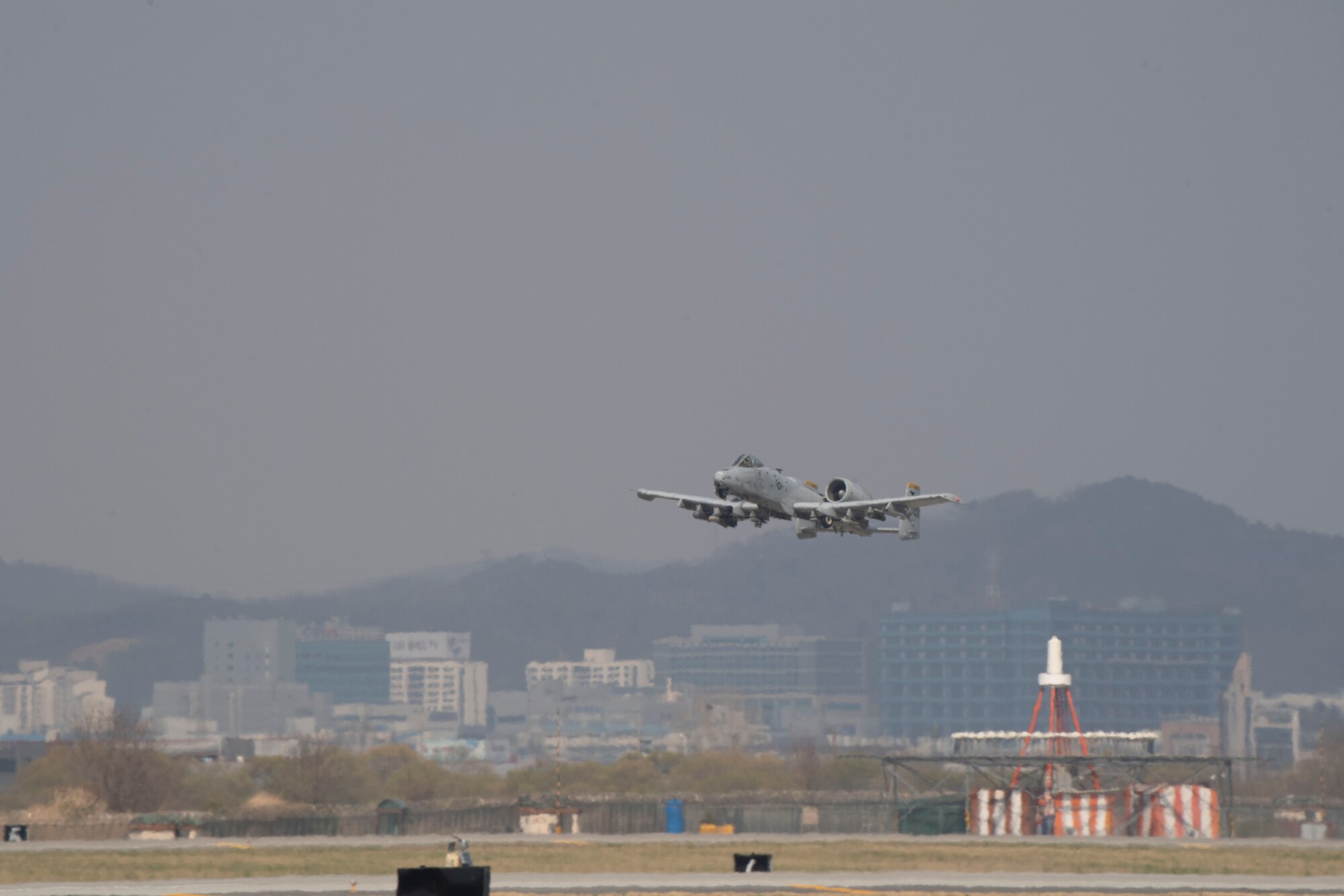 A 25th Fighter Squadron A-10C Thunderbolt II ascends the skies April 9, 2020, at Osan Air Base, Republic of Korea. Amid the COVID-19 global pandemic, the 25th FS follows the United States Forces-Korea’s health protection control measures to preserve their mission capabilities while maintaining a high state of readiness to protect the ROK. (U.S. Air Force photo by Senior Airman Darien Perez)
