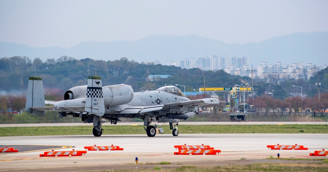 An A-10C Thunderbolt II taxiing down a runway.