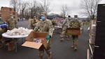 Members of the New York National Guard help distribute food to residents of Amsterdam and surrounding areas adversely affected by the COVID-19 outbreak. Fifty Soldiers served 1,000 people at Veterans Field Park in Amsterdam April 24, 2020.