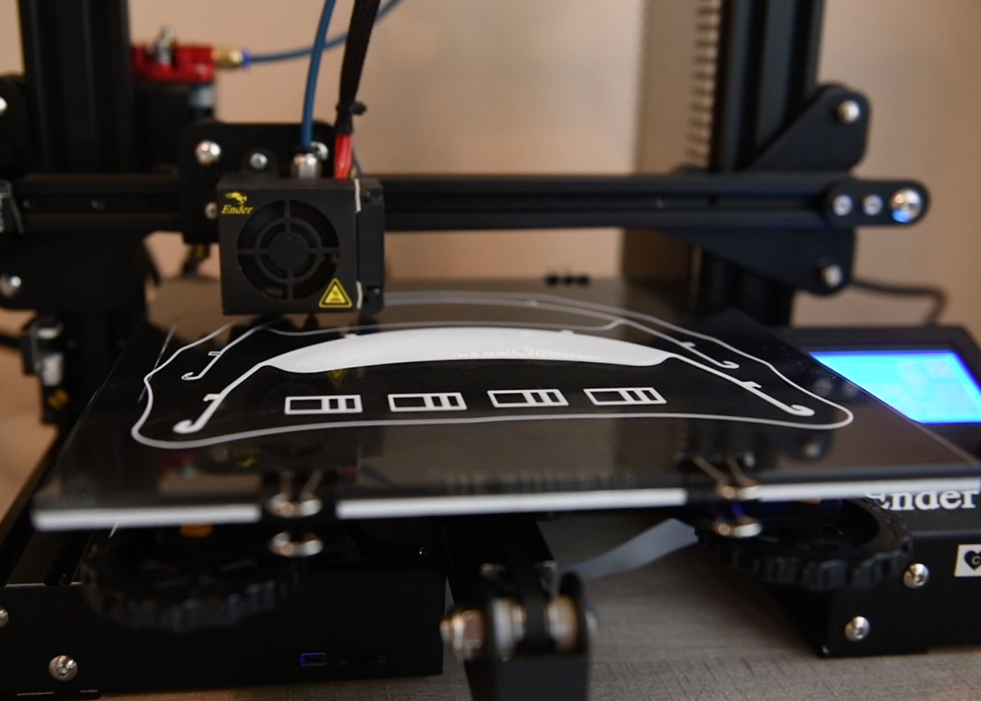 A 3D printer makes face shields.