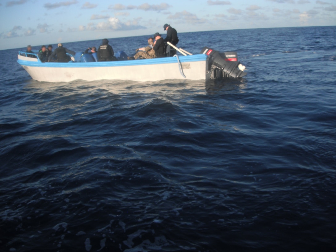 A U.S. Coast Guard boarding team searches a suspected smuggling vessel.