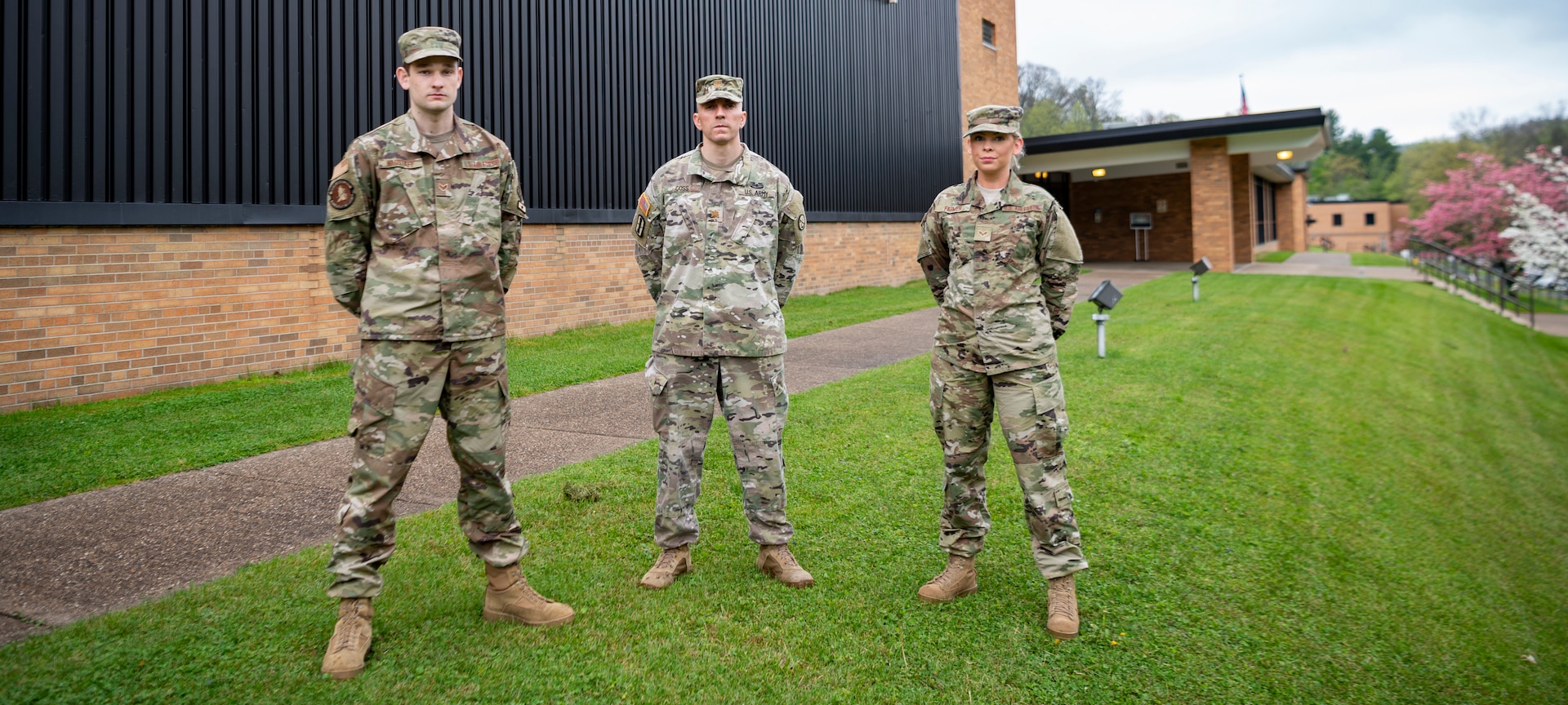 Senior Airman Will Wagstaff, left, Maj. Ryan Coss, center, and Senior Airman Carly Farmer outside the West Virginia National Guard Joint Forces Headquarters in Charleston, W.Va. Coss, Wagstaff and Farmer are serving on Task Force Petersen, which is forecasting demand for medical supplies in the state during the COVID-19 pandemic.