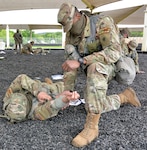 Basic Officer Leadership Course student practices providing Tactical Combat Casualty Ca