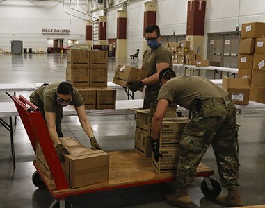 Wisconsin National Guard Soldiers unload equipment at an alternate care facility in Milwaukee April 20, 2020. The U.S. Army Corps of Engineers constructed the facility at Wisconsin State Fair Park and state and local officials are coordinating resources to staff and support the facility.