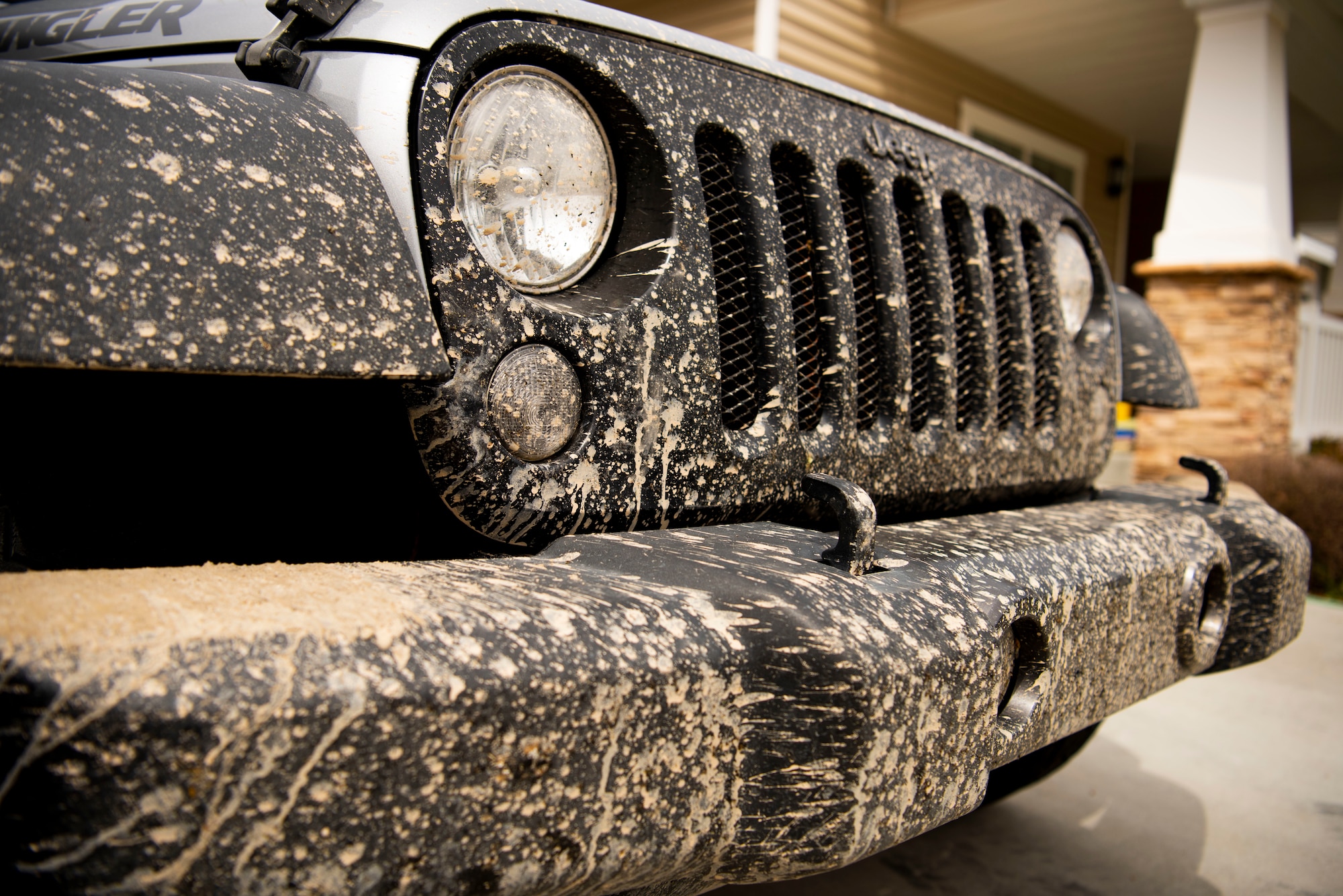 A dirty car is first in line to get a car wash from Airmen volunteering their time, April 22, 2020, at Mountain Home Air Force Base, Idaho. Airmen from the 366th OSS have been giving back to the community by helping do day-to-day tasks for families during the COVID-19 pandemic. (U.S. Air Force photo by Airman 1st Class Andrew Kobialka)