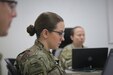 Spc. Chala Strosnider, a 68S Preventative Medicine Specialist with the 480th Medical Detachment (Preventive Medicine), reviews course materials with her instructors and classmates during the emergency Basic Leader Course (eBLC) in Jordan. Due to the current Coronavirus Disease 2019 (COVID-19) pandemic, junior enlisted Soldiers are continuing their professional military education through distance learning while travel restrictions are in place.