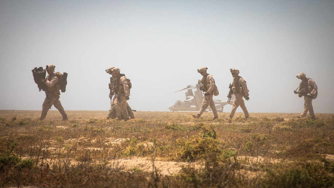 U.S. Marines load onto an MV-22 Osprey during a tactical recovery of aircraft and personnel exercise on Karan Island, Kingdom of Saudi Arabia, April 23, 2020.