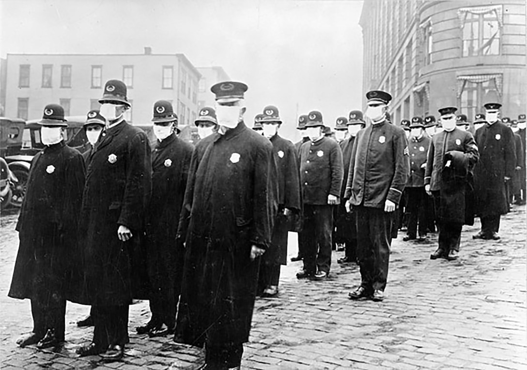 Policemen in Seattle wearing masks made by the Red Cross at the time of the Spanish flu outbreak, December 1918.
