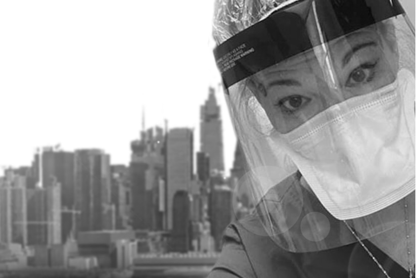 A photo illustration shows the face of a nurse wearing protective gear in front of the New York City skyline.