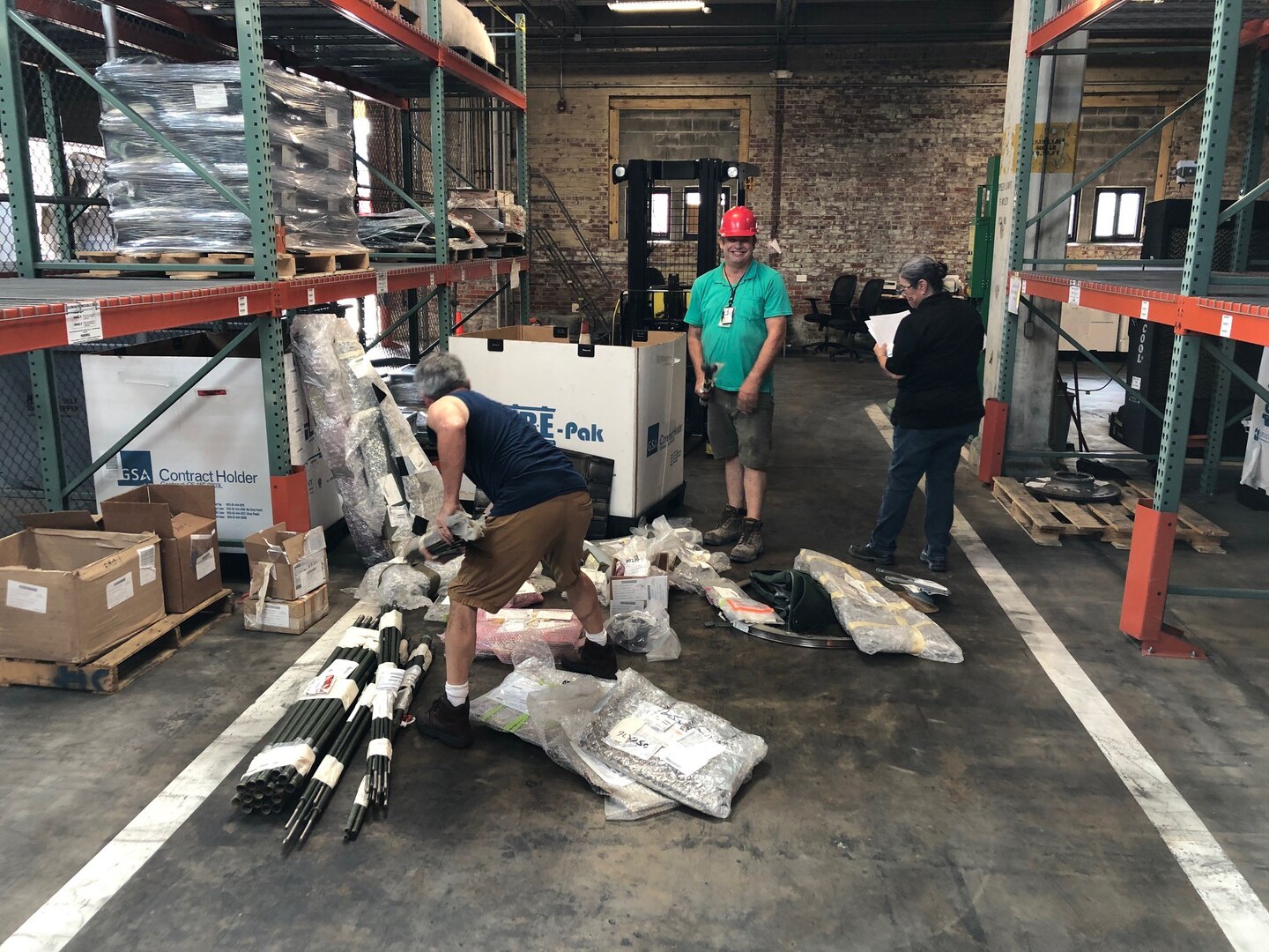 Rodney Baumgarden (left), Jeff Dixon (center)  and Cynthia Hineline (right) check items on-site at Camp Lejeune, North Carolina, in the first wall-to-wall inventory of all DLA Disposition Services sites.