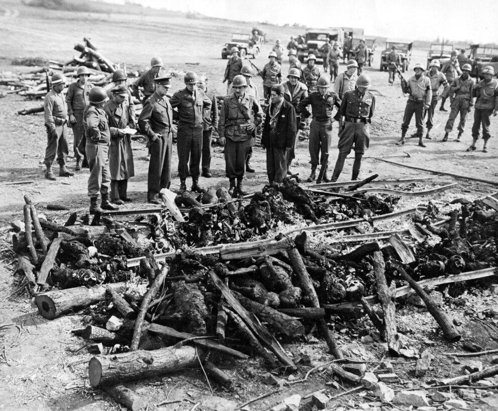 U.S. forces stand overlooking railroad track