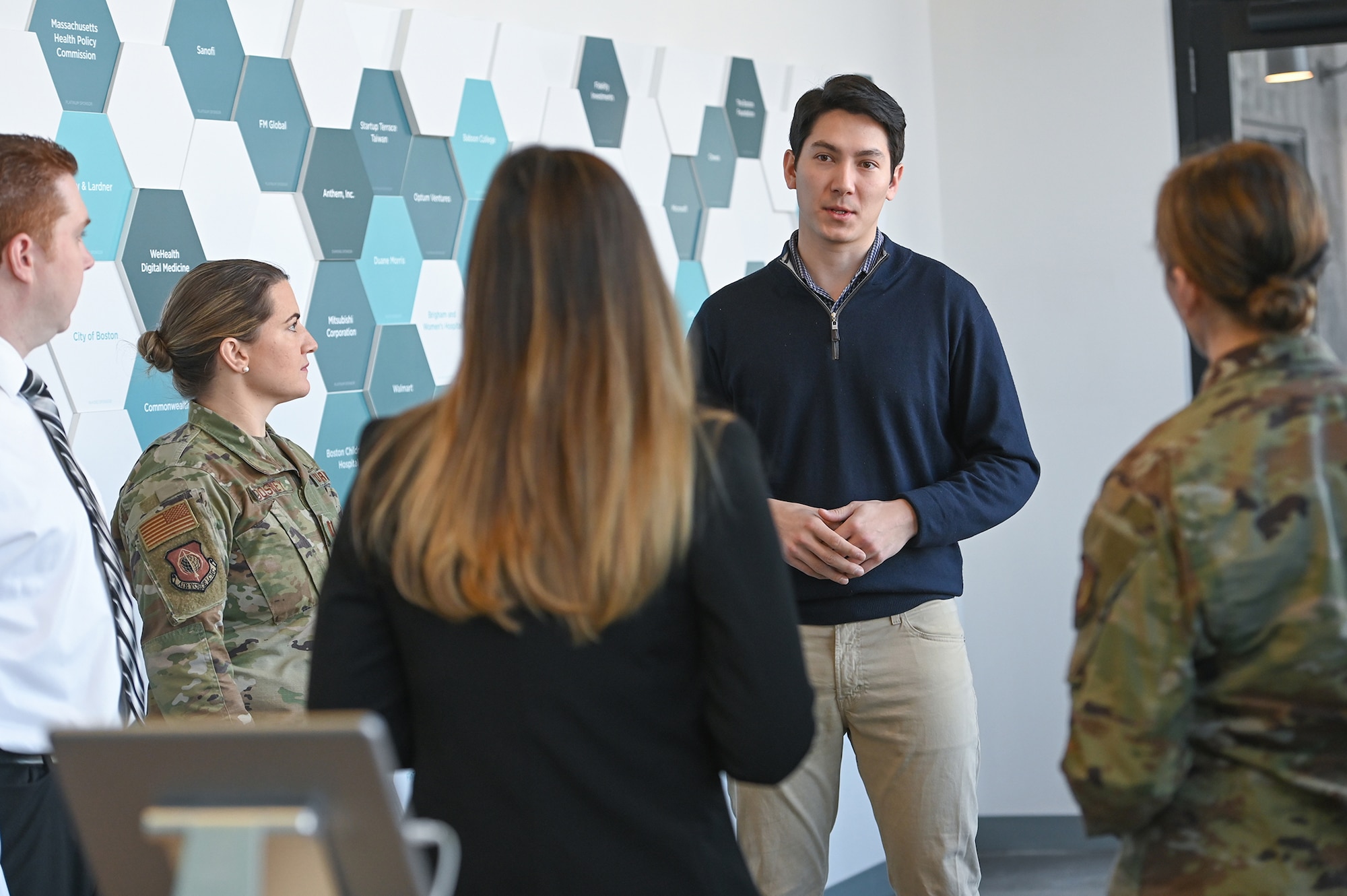 Christian Melton, center, senior partnerships manager for MassChallenge Boston, discusses The U.S. Air Force Lab with MassChallenge program with Capt. Teresa Doskey, a contracting officer for Digital’s Force Protection Division, from left, Brian Carr, director of innovation for Command, Control, Communications, Intelligence and Networks, Stacy Simon, Small Business lead for Digital, and Capt. Amanda Rebhi, chief innovation officer for Digital during a meeting at the MassChallenge facility in Boston, Mass., Feb. 21.