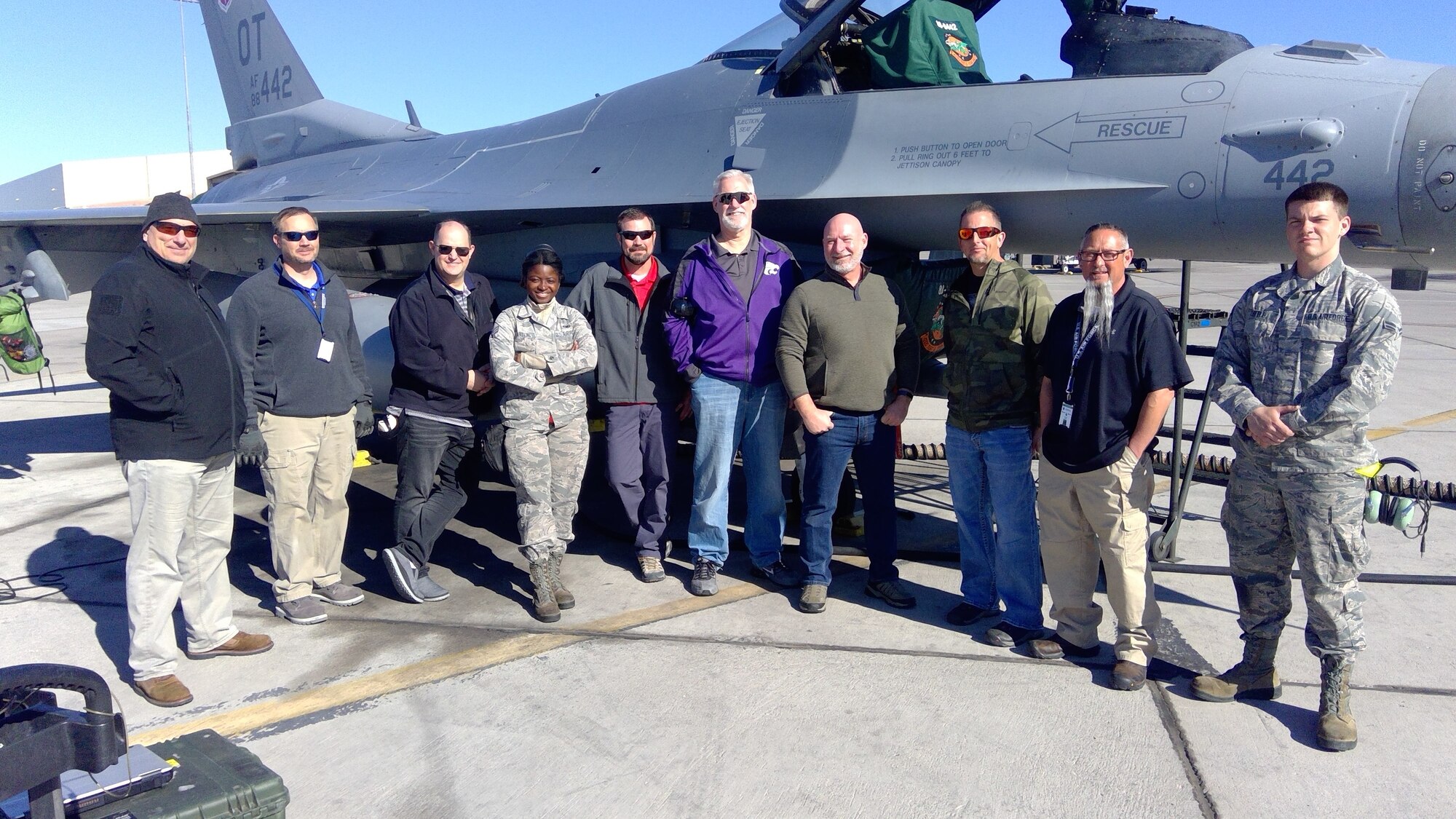 Group member (Left to Right) Terri George, Al Dawman, Jason Rasmussen, SrA Davonia Carter, Harold “Doogie” Hauser, Mark “Fish” Fowler, John Barber, Brian Thomas, Cliff Hamon and A1C Stephen Coffman, meet on the flightline at the Final M7.2+ Kitproof effort held at Nellis AFB Feb. 24-27, 2020.  (courtesy photo)