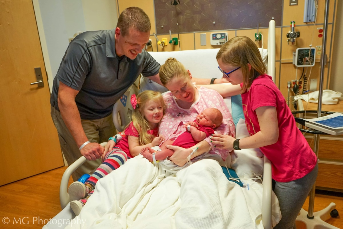 Photo of family celebrating a newborn