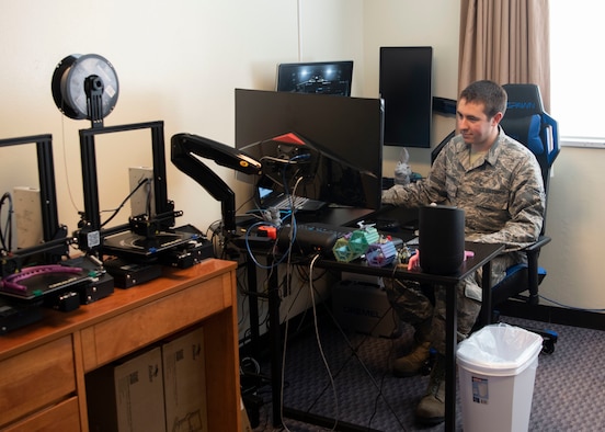 U.S. Air Force Airman 1st Class Vaughn Piwowarski-Mason, 18th Munitions Squadron munition systems specialist, prepares to print a 3D face shield through modeling software April 15, 2020, at Kadena Air Base, Japan. Piwowarski-Mason uses his personal 3D printer in his dorm room to make face shields to help protect personnel from COVID-19.