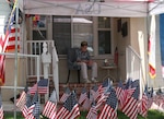 Retired U.S. Army Lt. Col. Sam Sachs watches a parade from his front porch  during a celebration in honor of his 105th birthday in Lakewood, California, April 26, 2020. Sachs was an officer with the 325th Glider Infantry Regiment, 82nd Airborne Division, and landed his glider on the beaches of Normandy during D-Day.