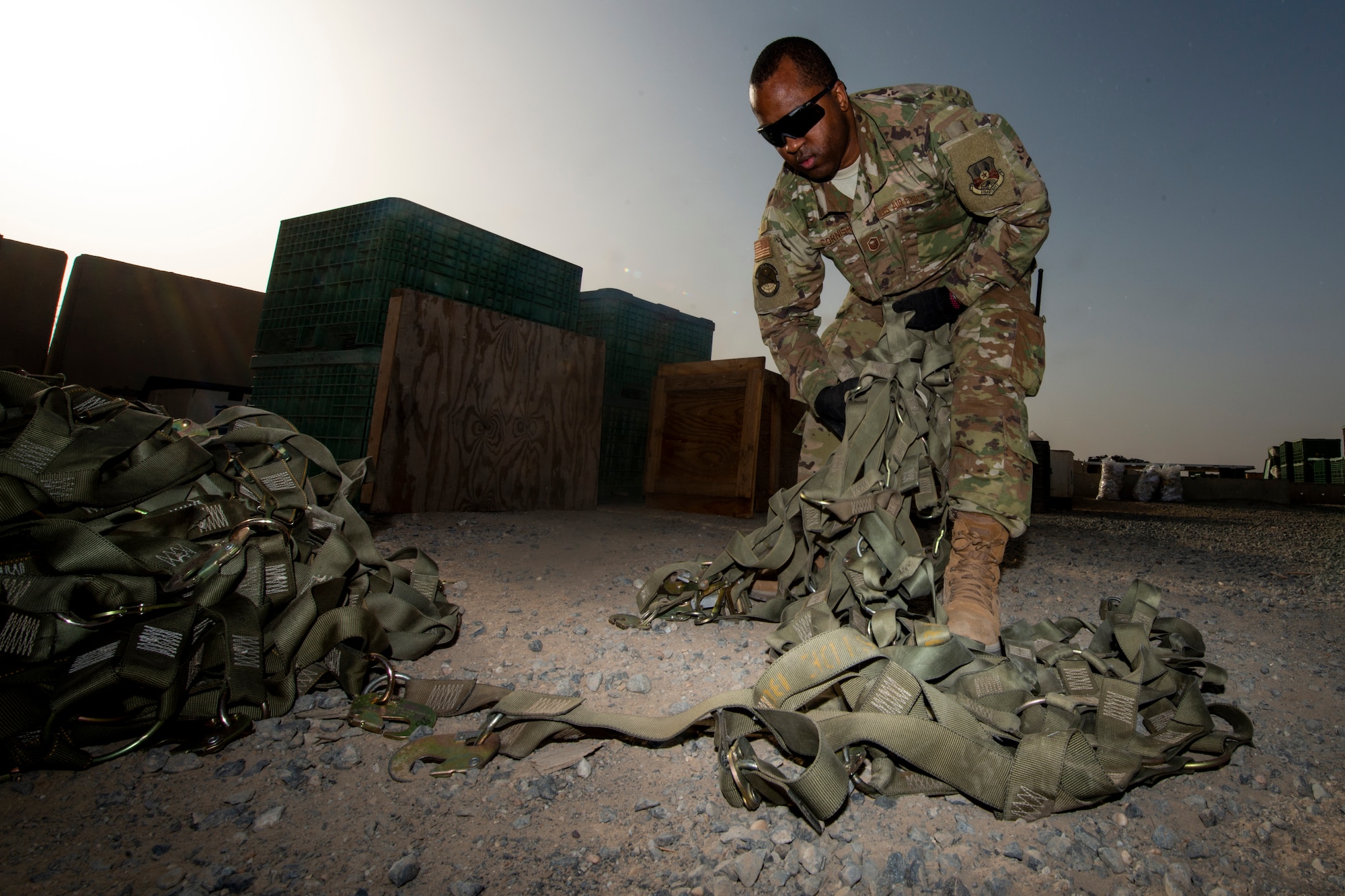 Photo of Airmen working on cargo nets