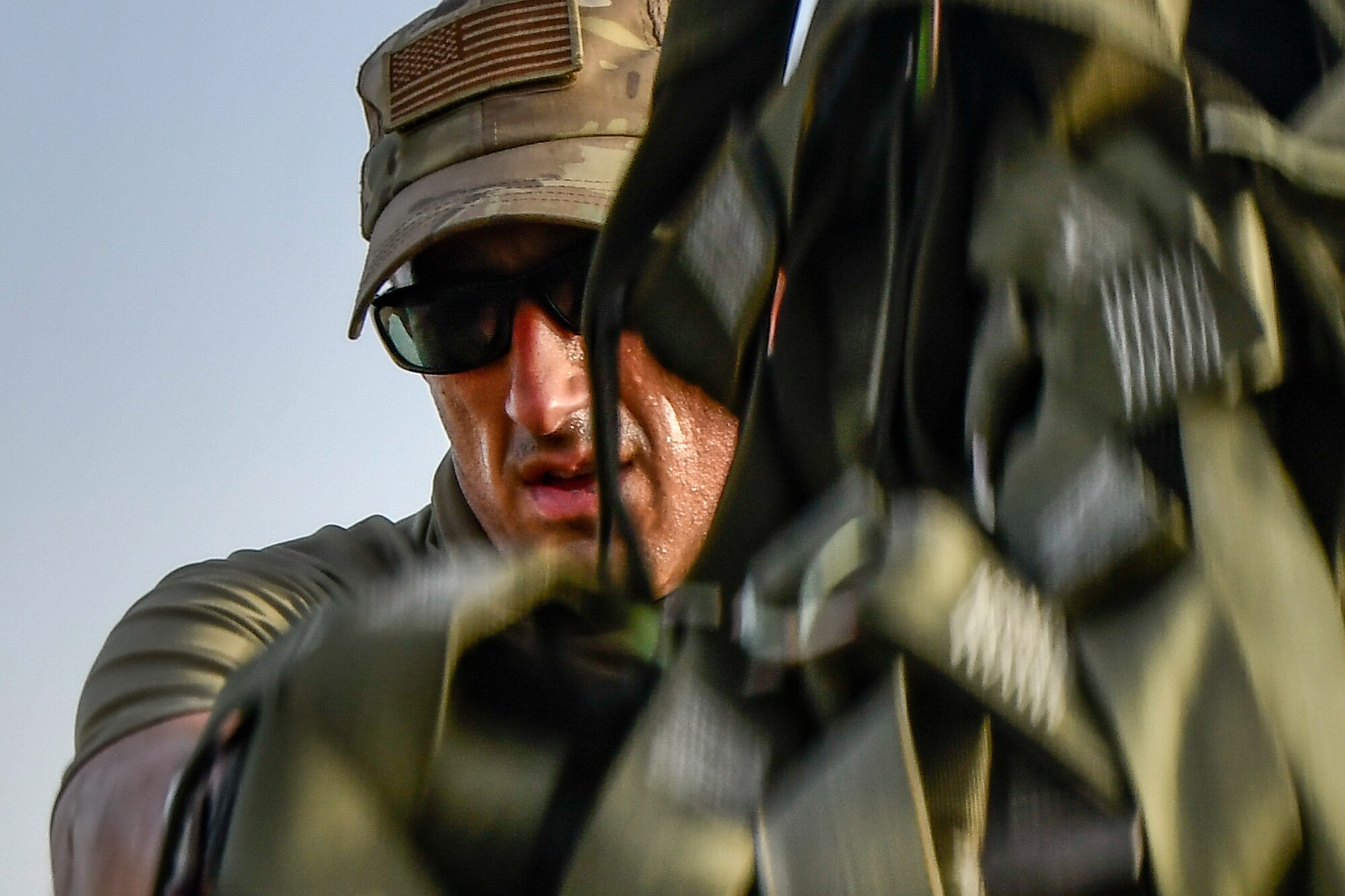 Photo of Airmen working on cargo nets