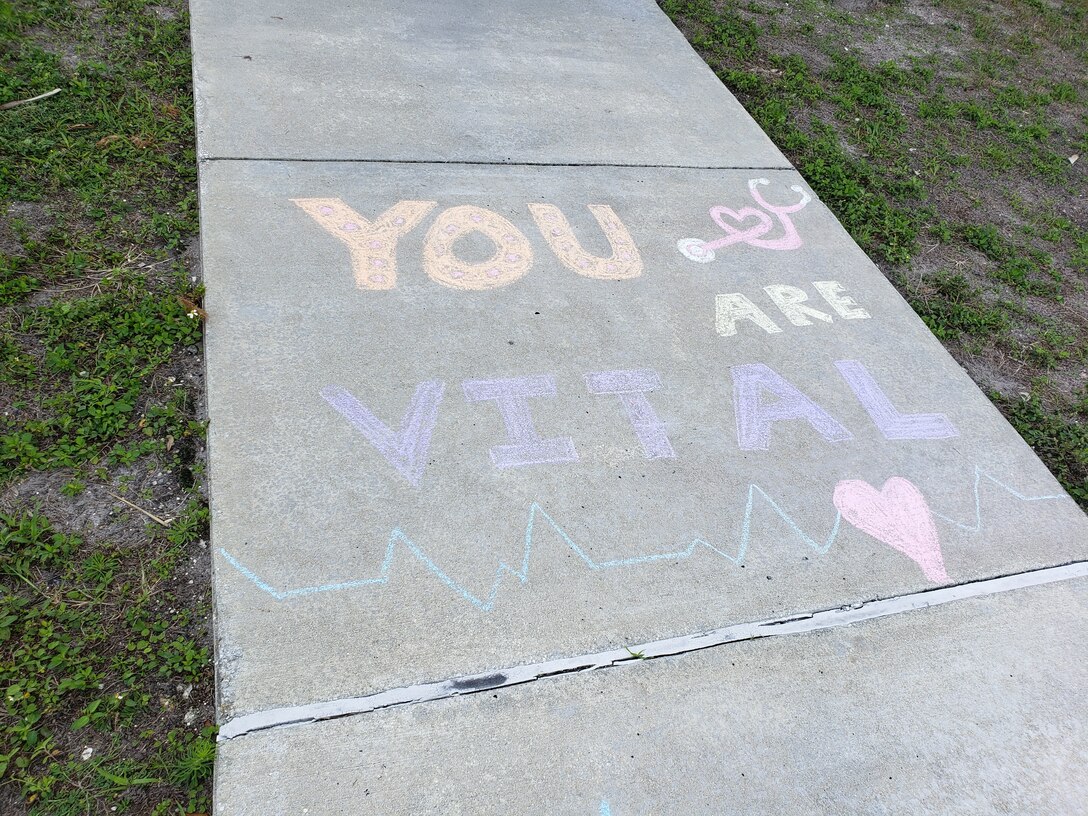 U.S. Central Command staff members visited the medical clinic aboard MacDill Air Force Base April 27, to chalk the walk and leave pictures and notes of support and appreciation for their efforts during the COVID-19 pandemic. (U.S. Air Force photos by Anna M. Hancock)