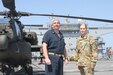 Lieutenant Colonel Margaret Stick, the commander of the Multi-Functional Aviation Task Force stands with Captain Scott Hattaway, the Captain of the USS Puller on April 15-16, 2020 in the Persian Gulf. Stick representing the U.S. Army Aviation and Hattaway representing the U.S. Navy worked together to conduct a joint at sea training exercise. (U.S. Army photo by SGT. Andrew Winchell)