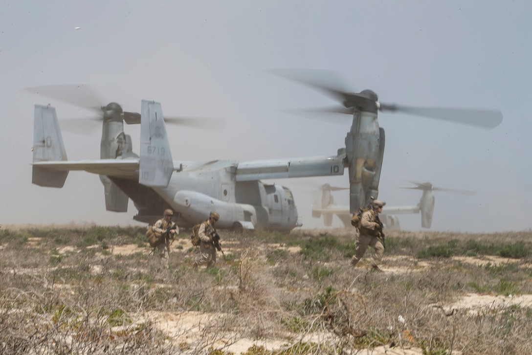 Marines assigned to Fox Company, Battalion Landing Team 2/8, 26th Marine Expeditionary Unit, exit an MV-22B Osprey to conduct platoon-level training on Kurayn Island, Saudi Arabia, April 22, 2020. The Bataan Amphibious Ready Group and 26th MEU, supported by air power from the Aviation Combat Element of the ARG/MEU, including AV-8B Harriers and attack helicopters, are conducting routine sustainment training in the U.S. 5th Fleet area of operations in order to enhance the Navy-Marine Corps team’s ability to employ low-signature, operationally relevant and strategically mobile crisis response forces to project power over key maritime terrain. (U.S. Marine Corps photo by Cpl. Tanner Seims)