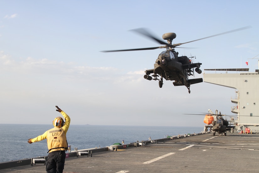 An AH-64E Apache gunship lands on the deck of the U.S.S. Lewis B. Puller during a training exercise on April 15-16, 2020 in the Persian Gulf. . The U.S. Army and the U.S. Navy work together to increase both their forces capabilities. (U.S. Army photo by SGT. Andrew Winchell)