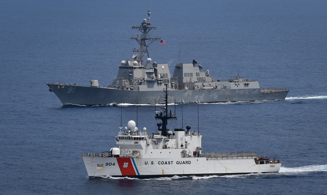 U.S. Coast Guard Cutter Northland and USS Pinckney at sea together.