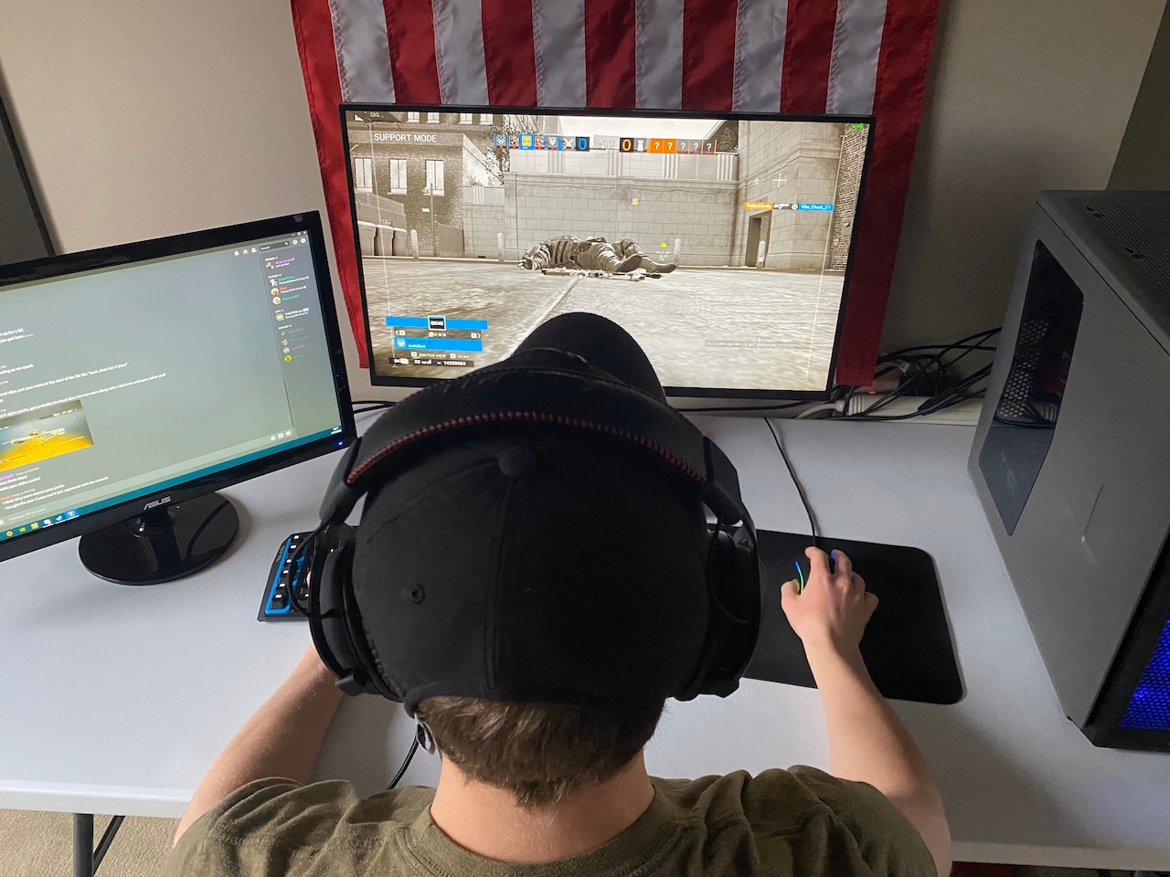 A cadet playing Tom Clancy’s Rainbow Six Siege on a computer.