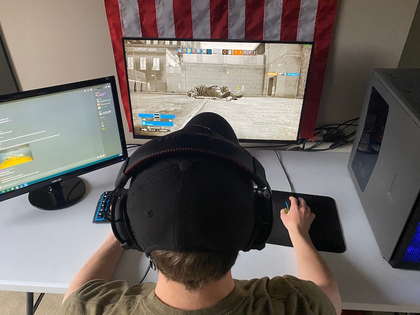 A cadet playing Tom Clancy’s Rainbow Six Siege on a computer.