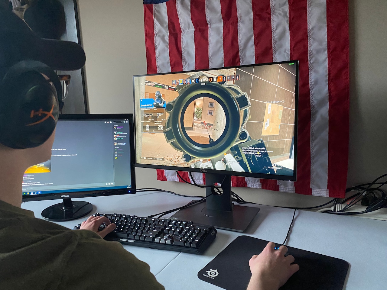 A cadet playing Tom Clancy’s Rainbow Six Siege on a computer.