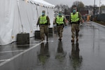 Security Forces and Military Police from the Massachusetts National Guard patrol a COVID-19 testing site for the homeless to protect supplies, patients and medical staff, Springfield, Massachusetts, April 21, 2020. Security Forces Airmen of the 104th Fighter Wing and Military Police Soldiers of the 211th Military Police Battalion, 747th Military Police Company, are working jointly as a quick reaction force in response to COVID-19.