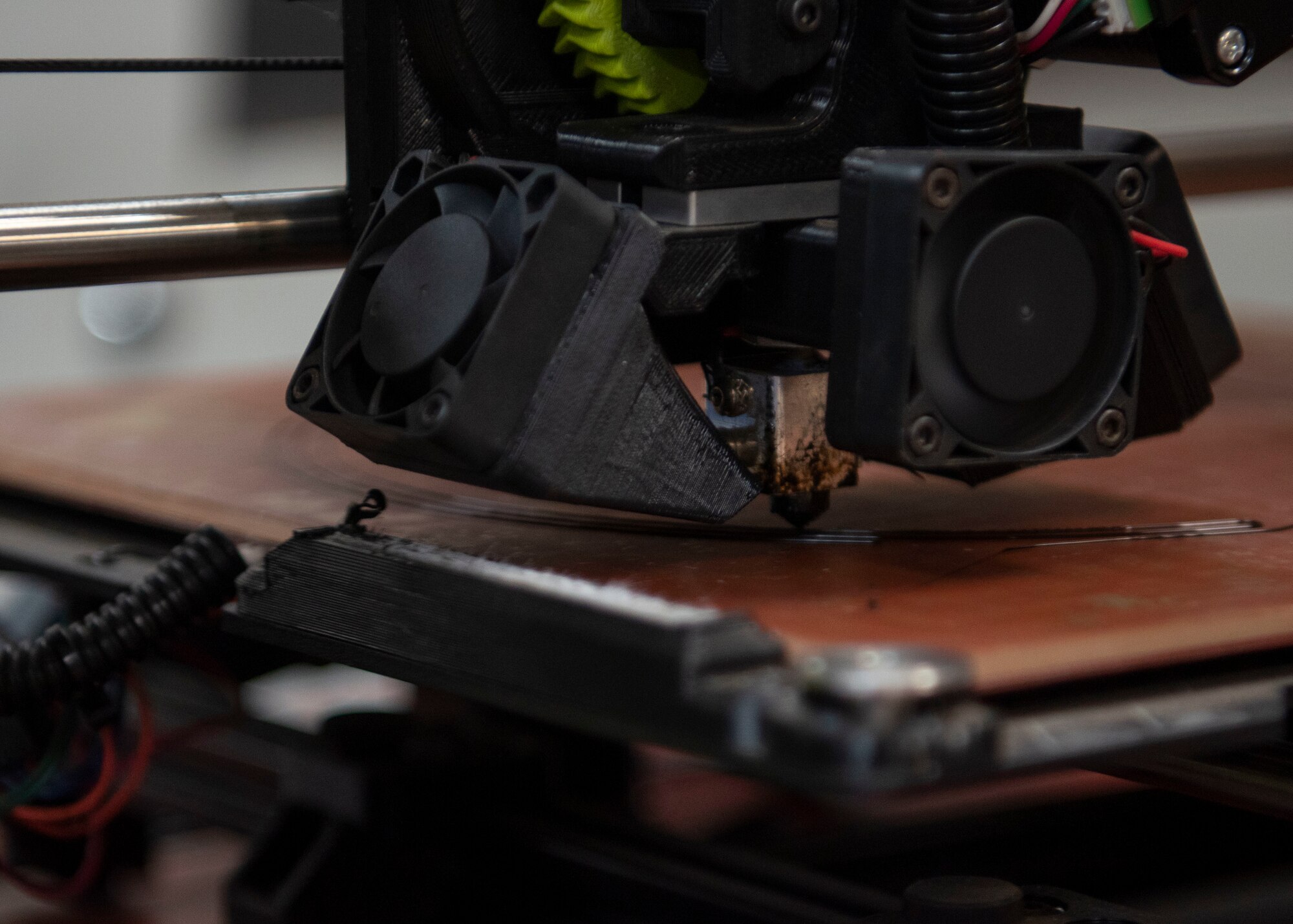 A 3D printer creates a prototype face shield April 9, 2020, at Kadena Air Base, Japan. The 18th Equipment Maintenance Squadron works to produce mask frames and face shields for use in the fight against COVID-19.