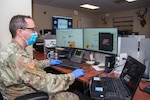U.S. Army Capt. Alexander Gibson, Arapahoe County Task Force Emergency Operations Center Operations Planner, performs plans and logistics operations at the Arapahoe County Sheriff’s Office’s emergency operations center April 8 in Centennial, Colo. Members of the Colorado National Guard volunteer to support state and local officials combat the COVID-19 pandemic by assisting state and local emergency operations centers statewide, setting up a joint operations center and preparing shelters for those without homes in the Denver area.